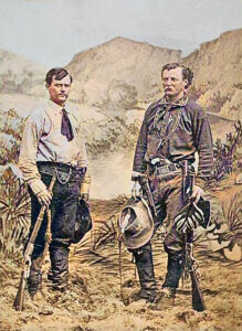 Jack Stilwell (at right) stands with James N. Jones, a fellow scout at Fort Sill, Oklahoma in about 1874.