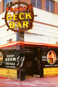 Tommys Deck Bar on Miami Beach, was a popular stop in the Art Deco District. It is long gone today. Phoeo by Walter Smalling, 1980.